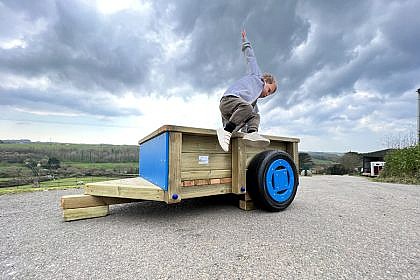 Open Trailer with little boy jumping off