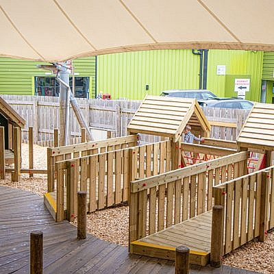 Little Boy Playing on Kidzworld Jungle Huts