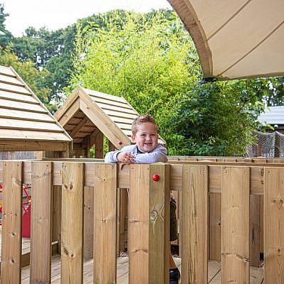 Little Boy Playing on Bridge