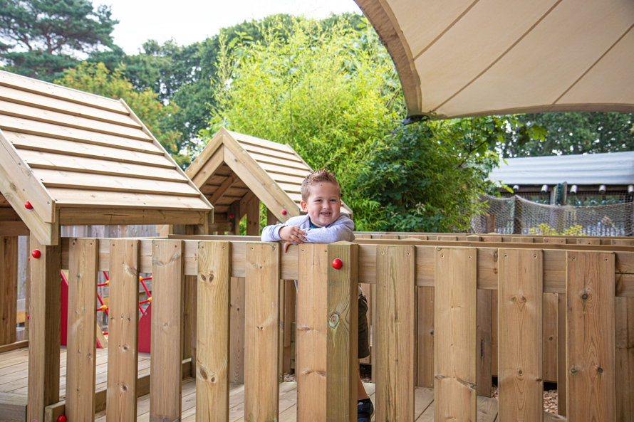 Little Boy Playing on Bridge