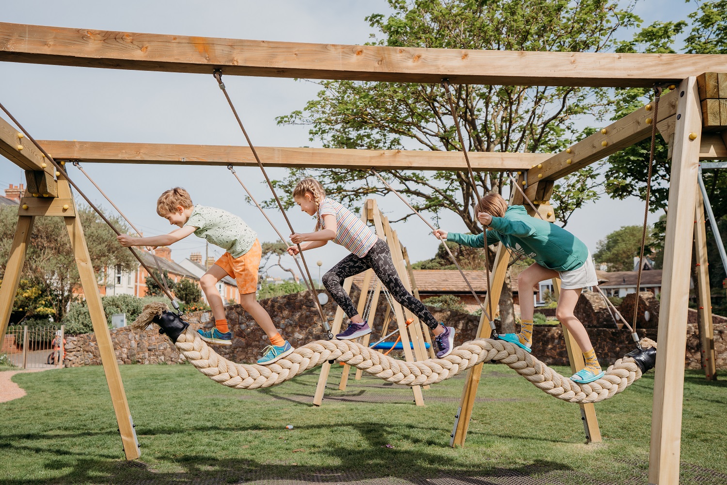Snake Rope Swing with three children playing on it
