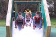 Trailer slide with three children playing