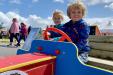 Children Playing on a Play Race Car