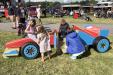 Children Playing on a Play Race Car