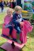 Children Playing on Pig Rocker