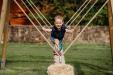 Litttle Boy Swinging on Snake Rope Swing